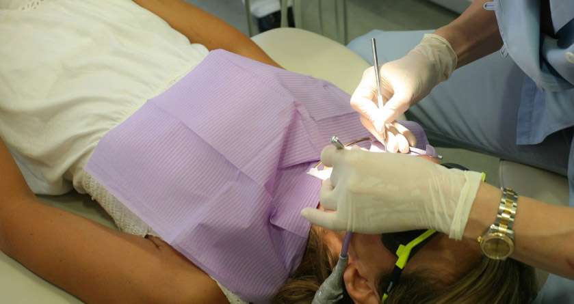 woman under dental sedation for dental surgery