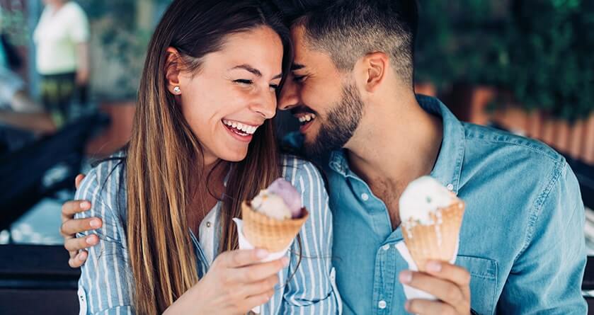 man and woman eating ice cream cones after oral surgery