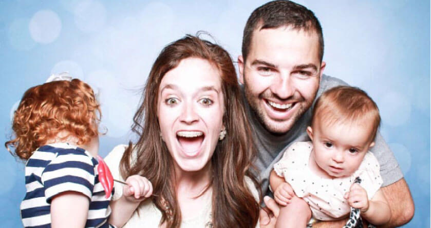 mother and father and two young kids happy about family block appointments at the dentist