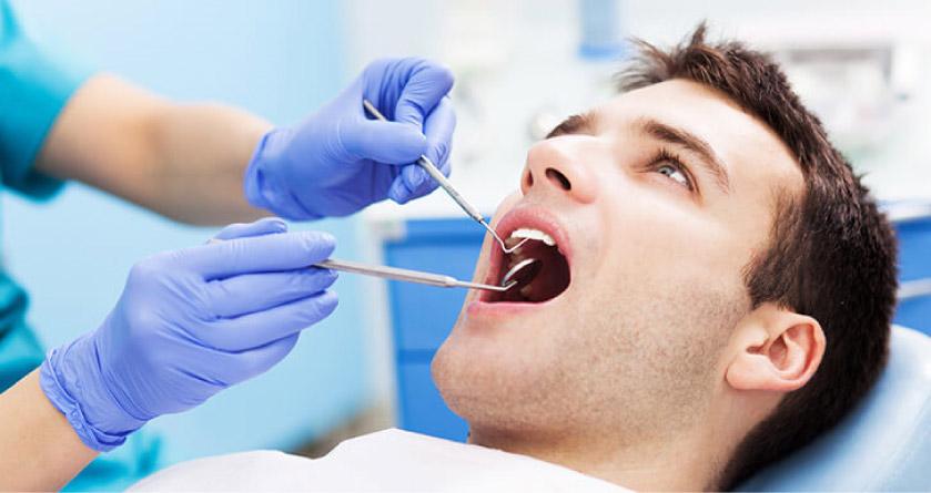 man getting an oral cancer screening