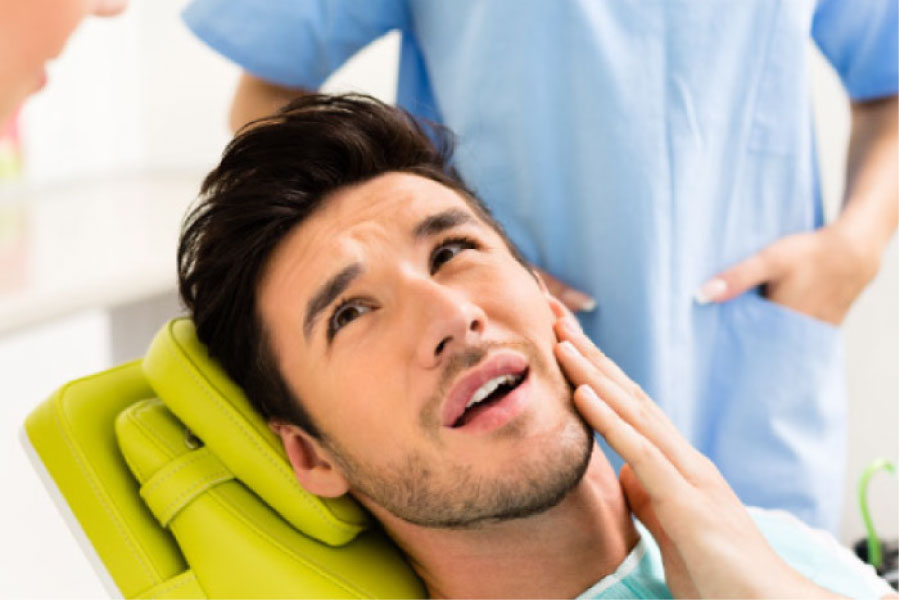 man in the dentist chair ready for wisdom teeth removal